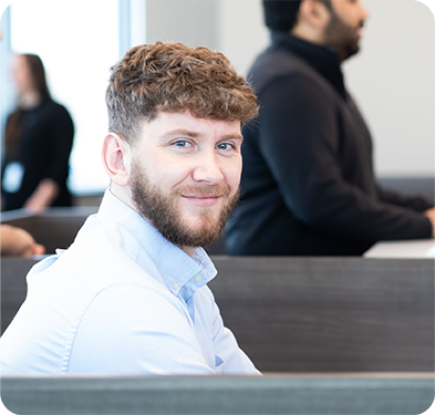 Smiling man at a computer