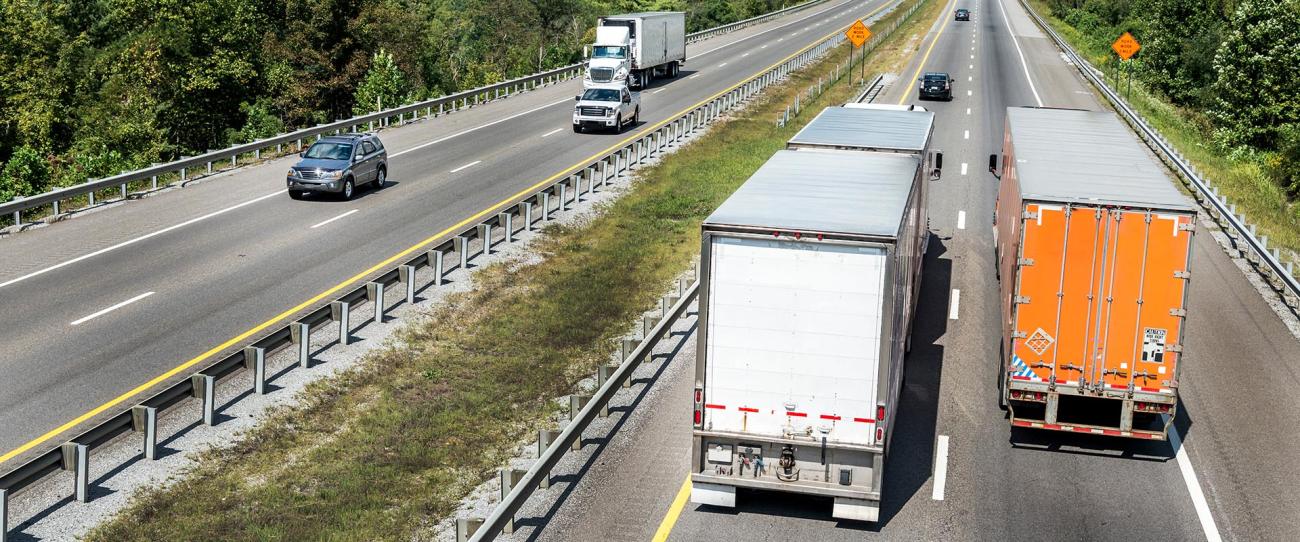 trailer driving down interstate bg